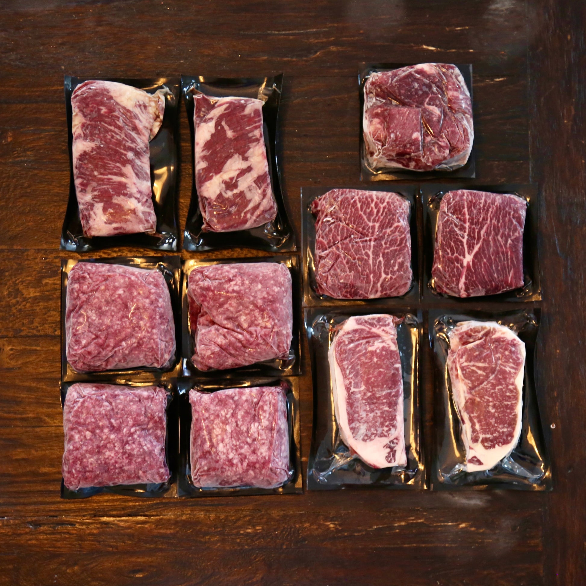 Spring Essentials Montana Beef Bundle from S Ranch Meats featuring New York Strip, Flat Iron, and Ground Beef with recipe cards.
