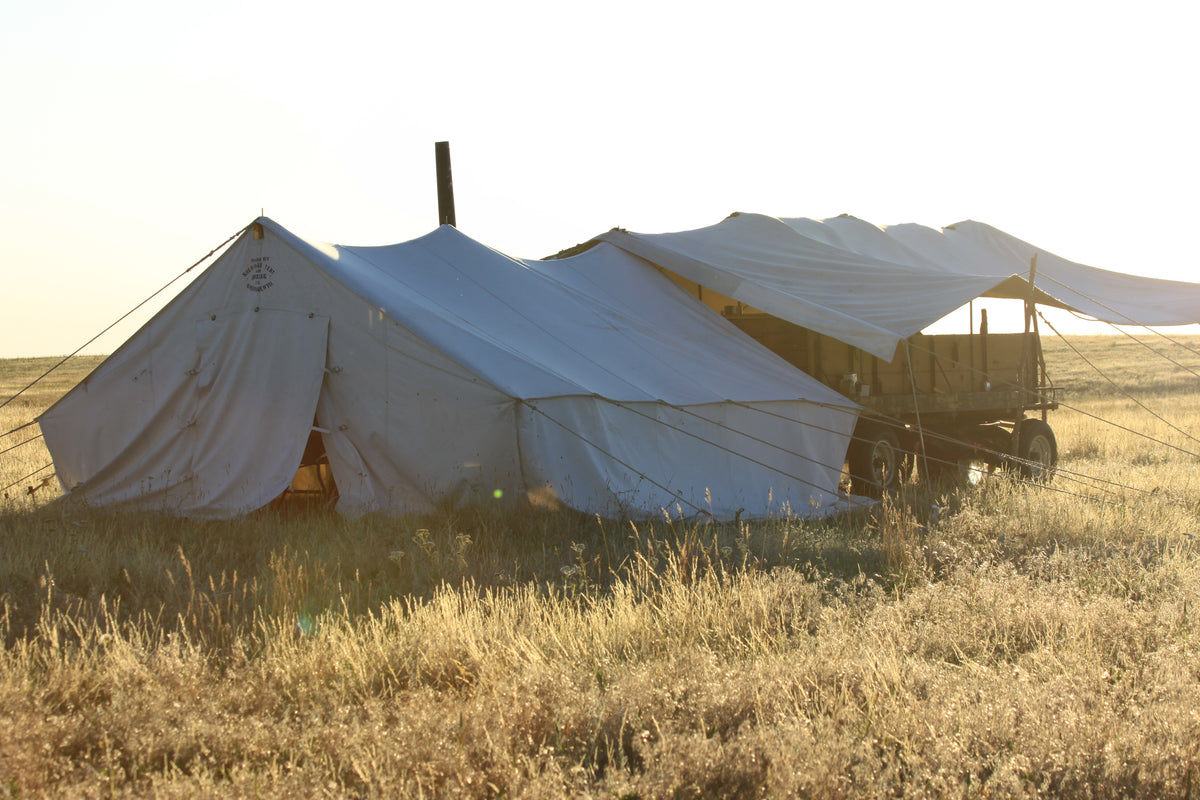 Wall tent and wagon on the prairie