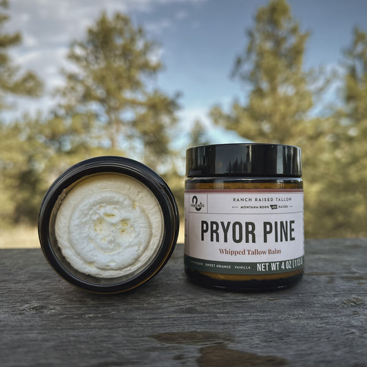 Close-up of whipped tallow balm texture beside the Pryor Pine jar, S Ranch Meats Hardin Montana