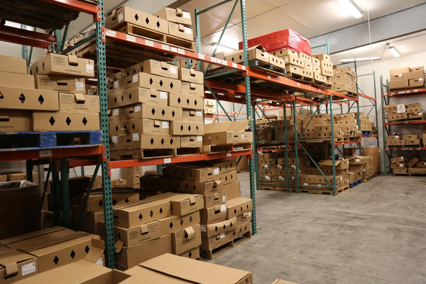 Racks of boxed custom-processing orders ready for pickup at the Hardin plant