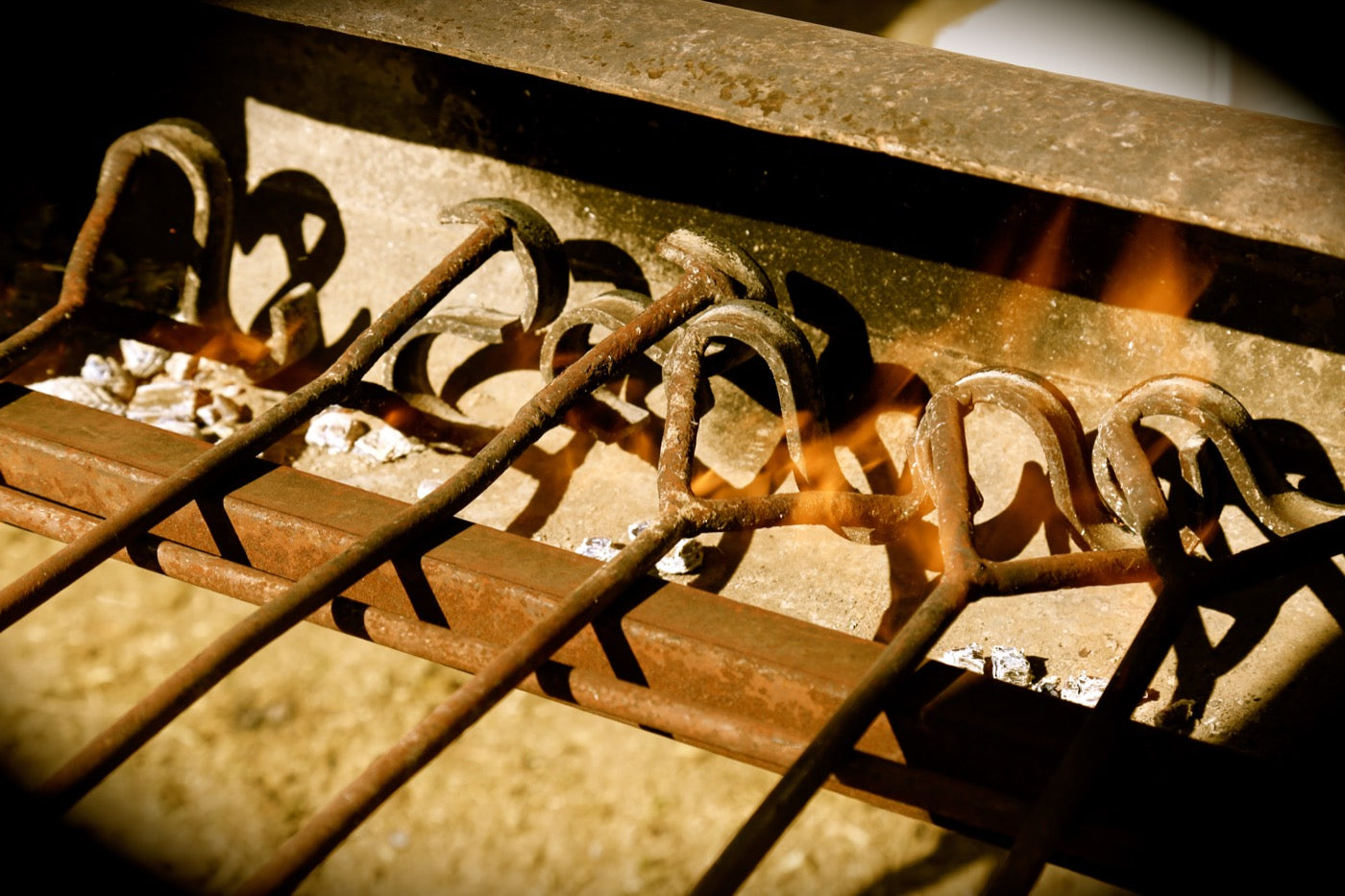 S Ranch branding irons heating in the fire